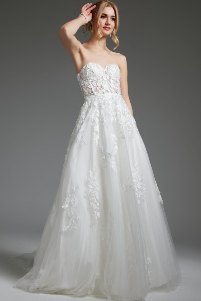 Model in Jovani JB05361, ivory gown with a flowing skirt and delicate embroidered bodice.