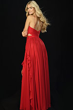 Back view of red gown with open back and layered ruffle train