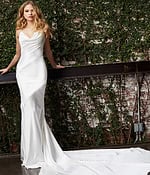 Model wearing Jovani JB03910 white dress with floor-length train, front view.