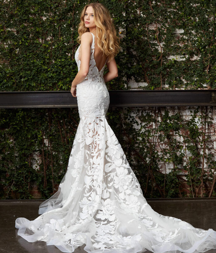 Model showcasing Jovani JB04192 white gown with a sweeping train
