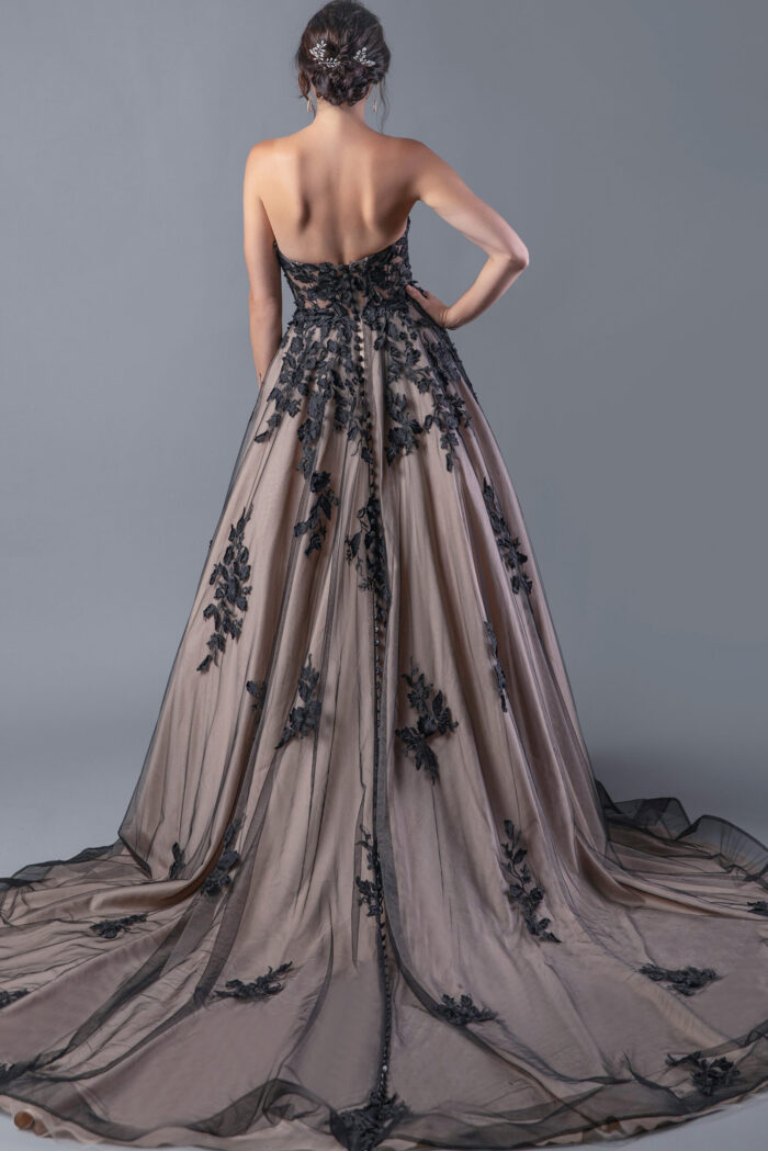 Back view of Jovani JB05361 in black, featuring detailed floral embroidery and a lengthy train.