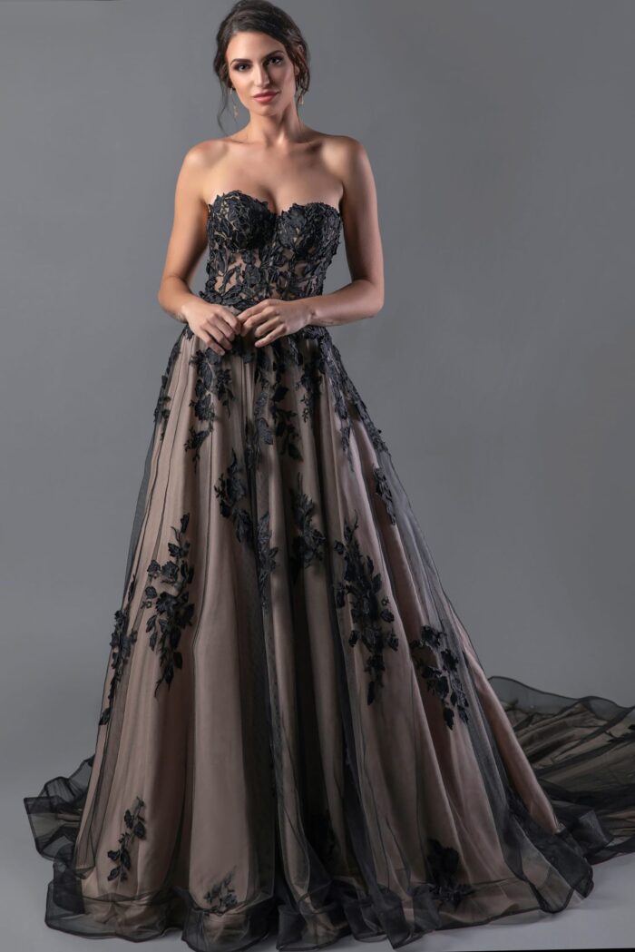 Model wearing Jovani JB05361, a black ball gown with a sweetheart neckline and floral design.