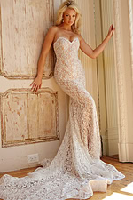 Model wearing Jovani JB06588 Ivory lace gown with sweetheart neckline and elegant train.