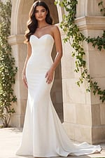 Strapless sweetheart fitted gown with smooth satin finish and small train.