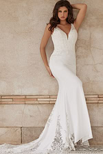 Model in Jovani JB06928 showing fitted silhouette with lace appliqués.