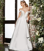 Model wearing Jovani JB07134 elegant ivory A-line gown with off-the-shoulder neckline and beaded detailing, front view.