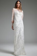 Close-up of Jovani JB07376 white gown featuring illusion neckline and detailed beading.