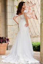 Model showing back of Jovani JB07161 dress with lace train