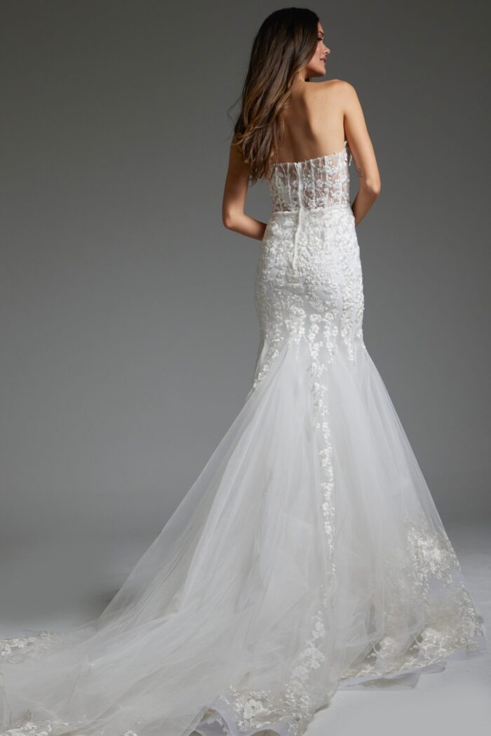 Back view of model wearing Jovani JB07260 white mermaid silhouette dress with lace details