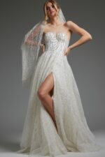 Model wearing JB07578 ivory gown featuring a strapless sweetheart neckline and high slit.