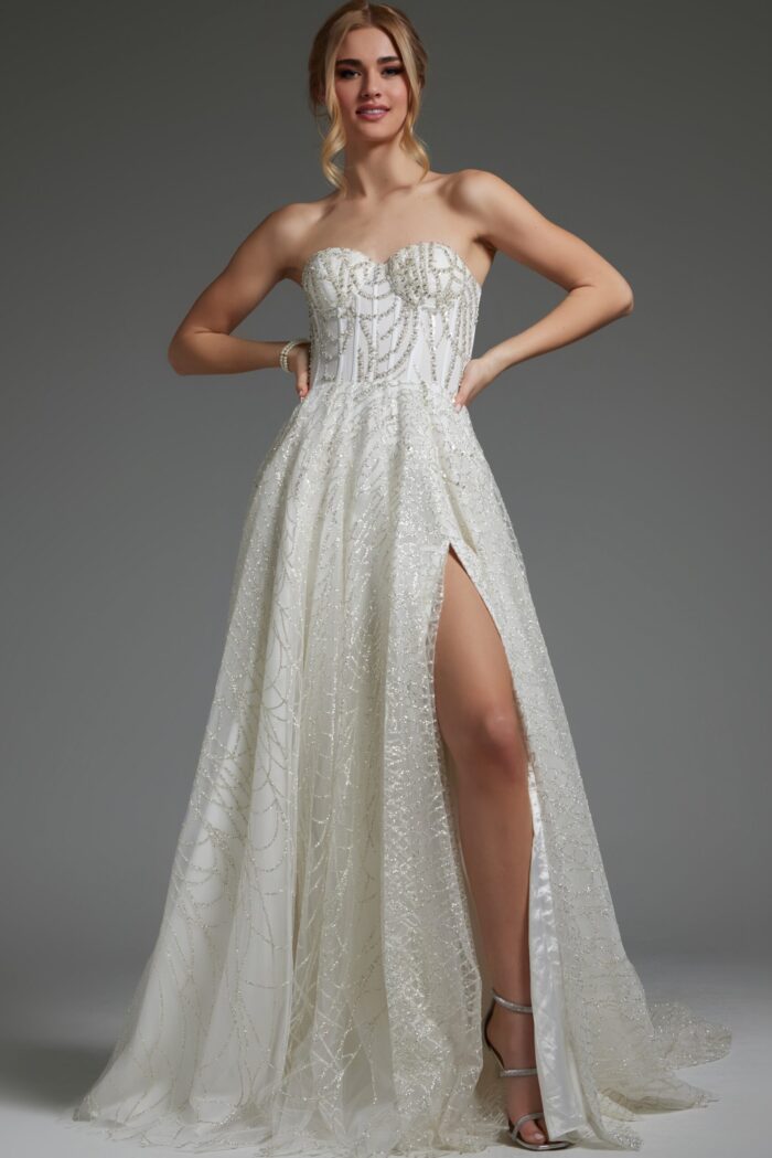 Model in JB07578 ivory dress showcasing strapless design and flowing skirt.