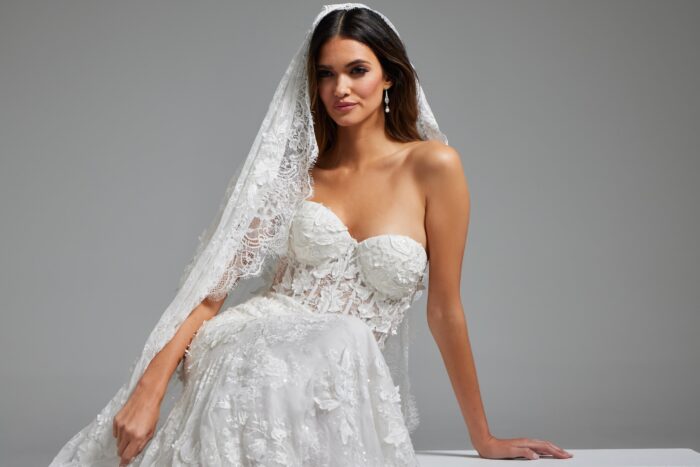 Jovani JB07583 white gown showcased with intricate lace and strapless design.