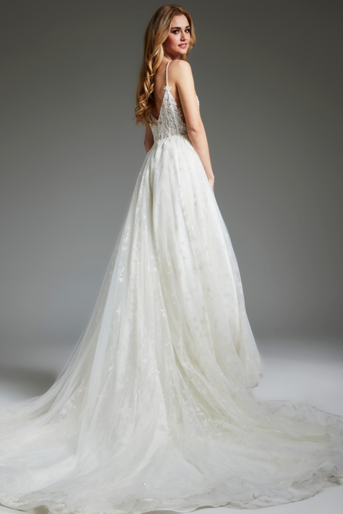 Model in Jovani JB07647 ivory dress, showcasing a graceful tulle skirt from the back.