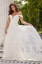 Model wearing Jovani JB220002 ivory dress with delicate lace in front view