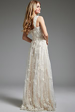 Model showing side view of Jovani JB220002 ivory gown with lace details