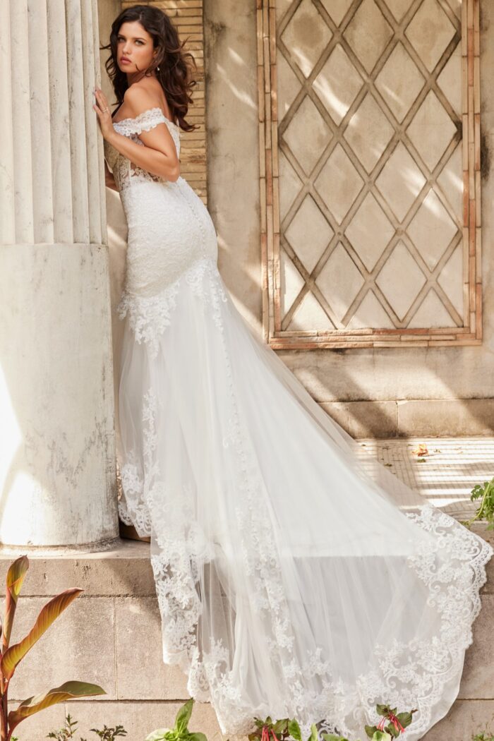 Close-up of Jovani JB220003 ivory gown with lace detail and short sleeves.