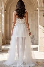 Sheer tulle overskirt bridal dress with structured lace bodice and open back