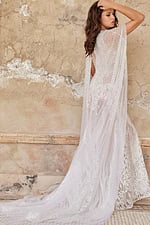 Model wearing Jovani JB23659 back view, showcasing the elegant sheer cape.