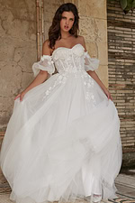 Model wearing Jovani JB23693 white gown with floral lace and puff sleeves, front view.