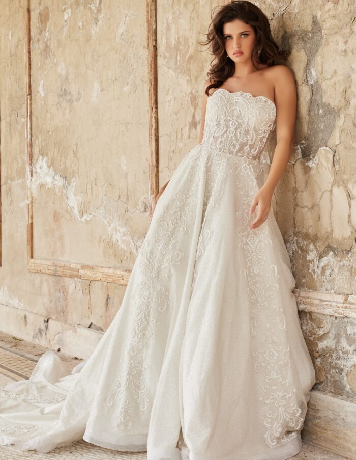 Jovani JB24563 wedding dress showing intricate lace details and elegant flow, front view.