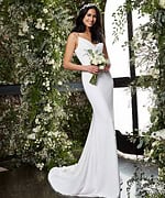Model wearing Jovani JB2507 ivory gown with a fitted silhouette and V-neckline