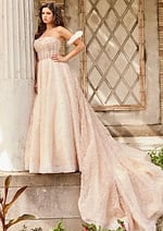 Model posing in JB26341 floor-length dress with flowing train and intricate lacework, front profile.