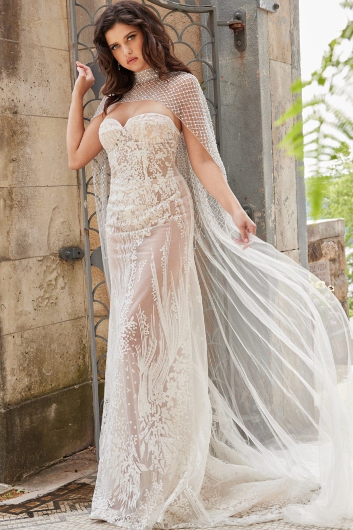 Model wearing Jovani JB23659 with a transparent sheer overlay and floral designs.
