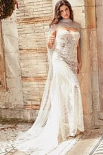Model in JB36547 white dress, beautifully capturing lace patterns and sheer fabric.