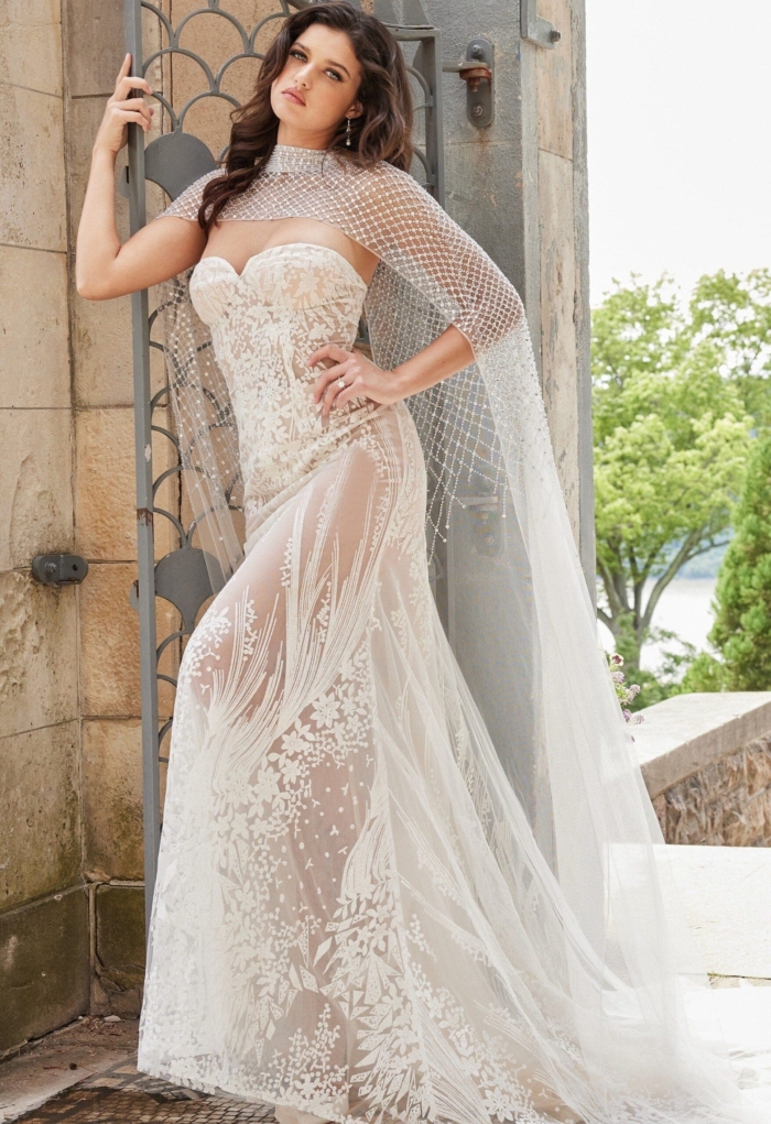 Detailed view of Jovani JB23659's lace overlay with decorative embroidery.