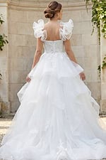 Romantic layered tulle bridal gown featuring floral bodice and soft organza ruffle sleeves