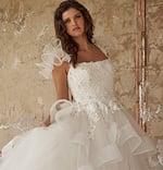 Front view of JB37575 white dress with ruffled accents