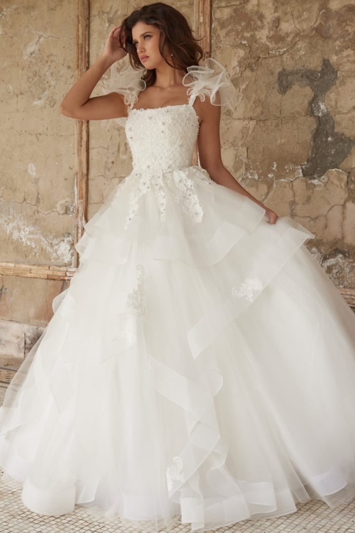 Side profile of model wearing JB37575 white gown