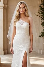 Romantic lace bridal gown with delicate floral embroidery and flowing train