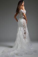 model wearing JB38224 white dress with floral appliqués, back view