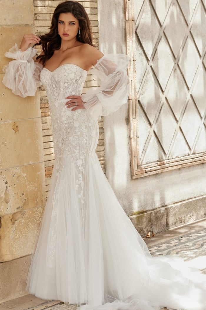 Model wearing Jovani JB38491 white dress with lace detail, front view.