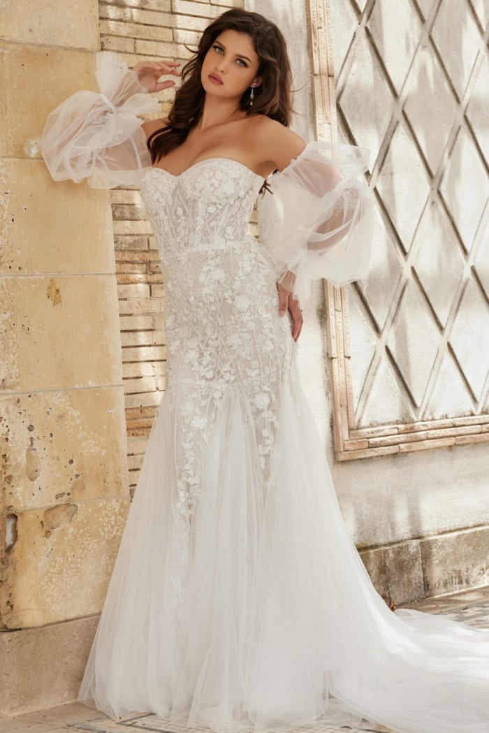 Model in Jovani JB38491 white dress, showcasing sleeve design.