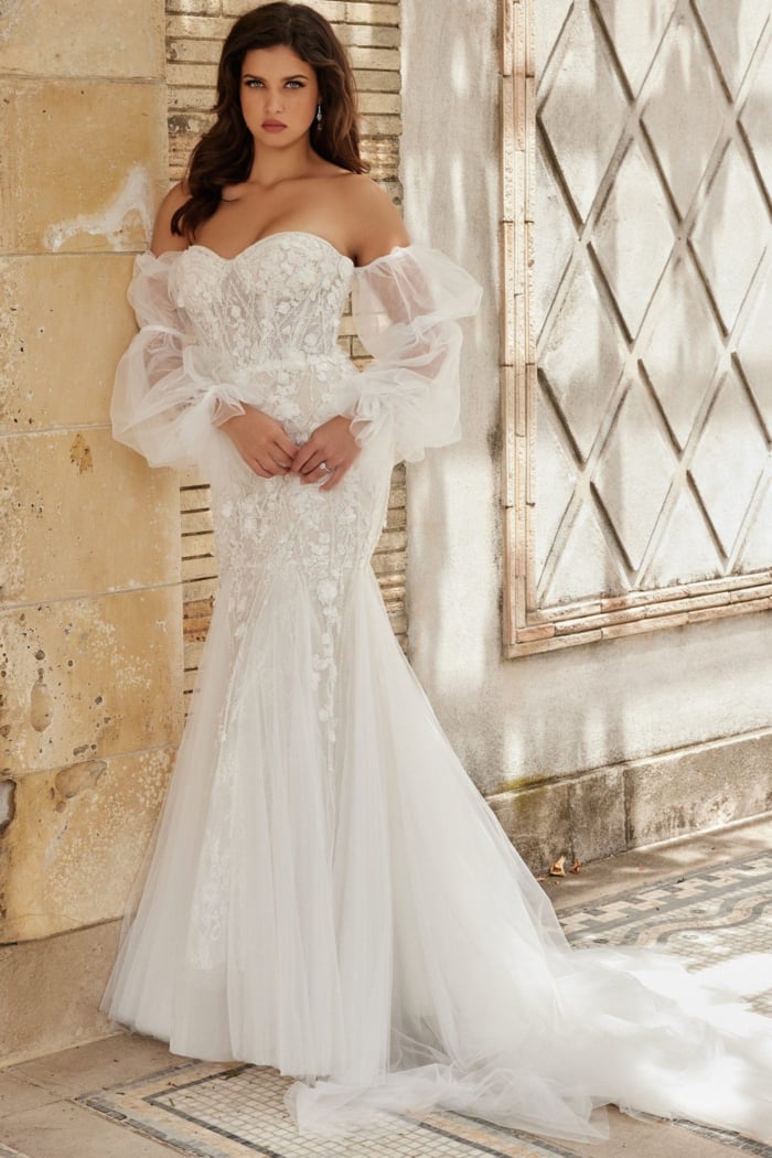 Model in Jovani JB38491 white dress, full length front view.