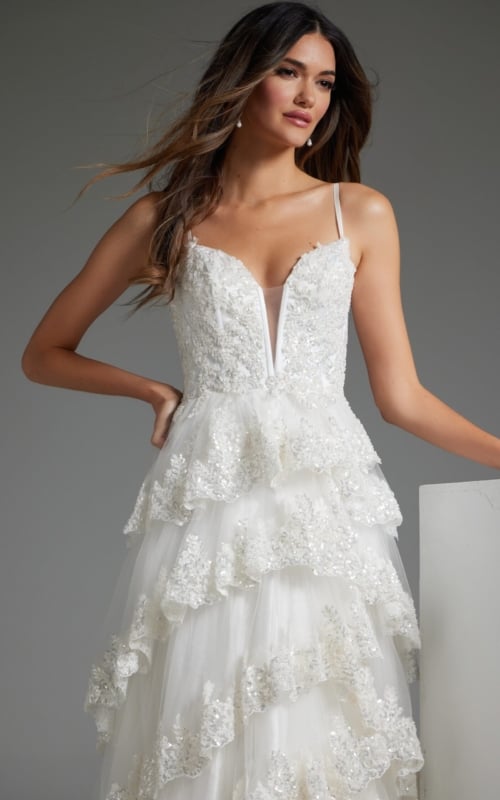 Model wearing JB38641 white dress, front view highlighting lace details and sweetheart neckline.