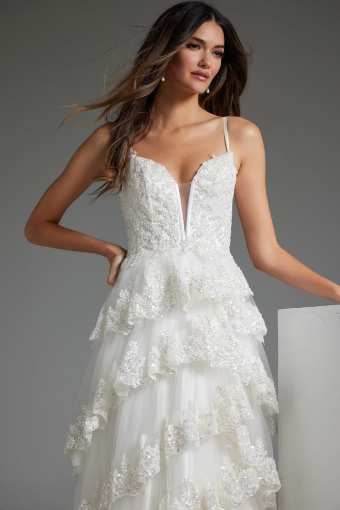 Model wearing JB38641 white dress, front view highlighting lace details and sweetheart neckline.