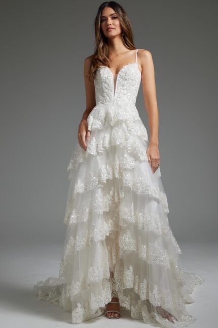 Model wearing JB38641 white dress, front view with layered skirt and sweetheart neckline.