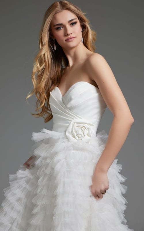 Side view of model in Jovani JB38958 white gown with tiered skirt.