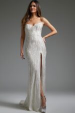 Model wearing Jovani JB39260 long white gown with sweetheart neckline and high slit.