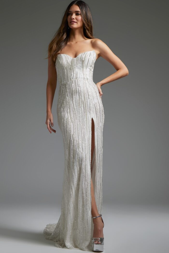 Model wearing Jovani JB39260 long white gown with sweetheart neckline and high slit.