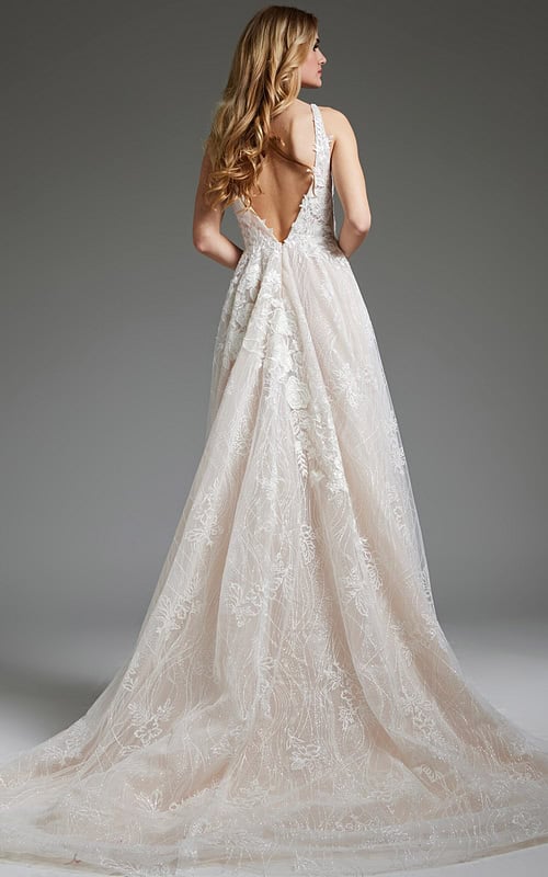 Model wearing Jovani 39435, back view of ivory gown showcasing deep V-back and lace design.