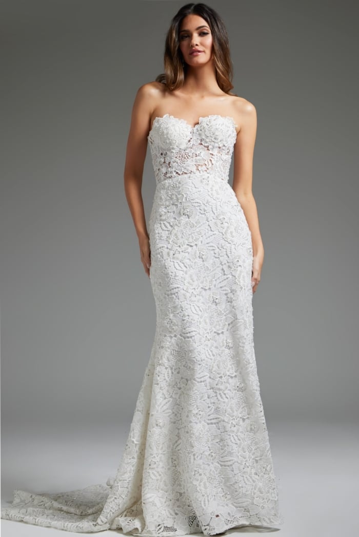 Model wearing Jovani JB39733 white gown, full-length view showcasing lace detail and silhouette.