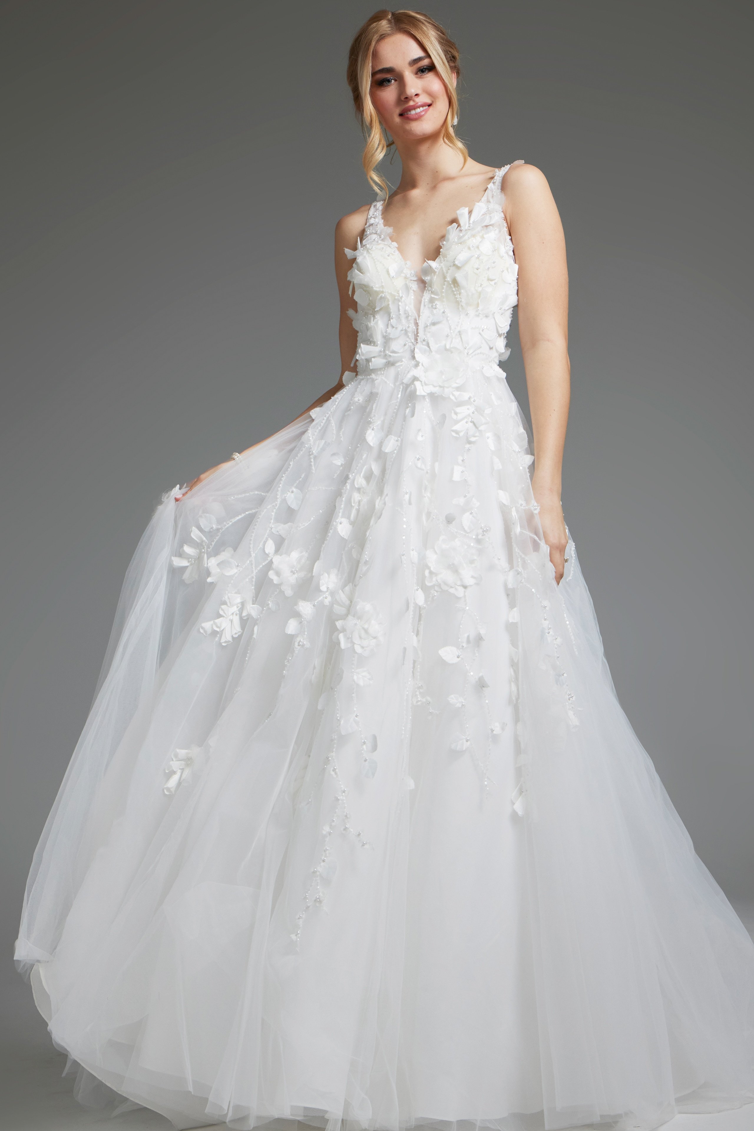 JB40511-IVORY-201.jpg Model wearing Jovani JB40511 ivory gown, front view, with floral appliqués and V-neckline.