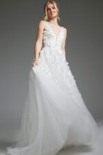 Model wearing Jovani JB40511 ivory gown, close-up front view, showcasing floral appliqués.