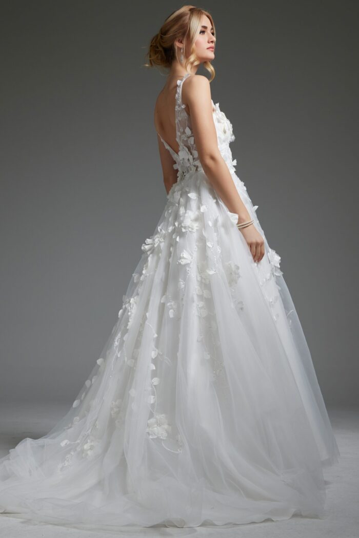 Model wearing Jovani JB40511 ivory gown, back view, highlighting the illusion back.