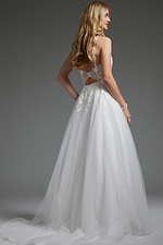 Side-back view of Jovani jb40513 ivory gown showcasing A-line silhouette and open back.