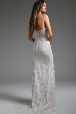 model wearing Jovani JB40590 back view white lace gown with low scoop